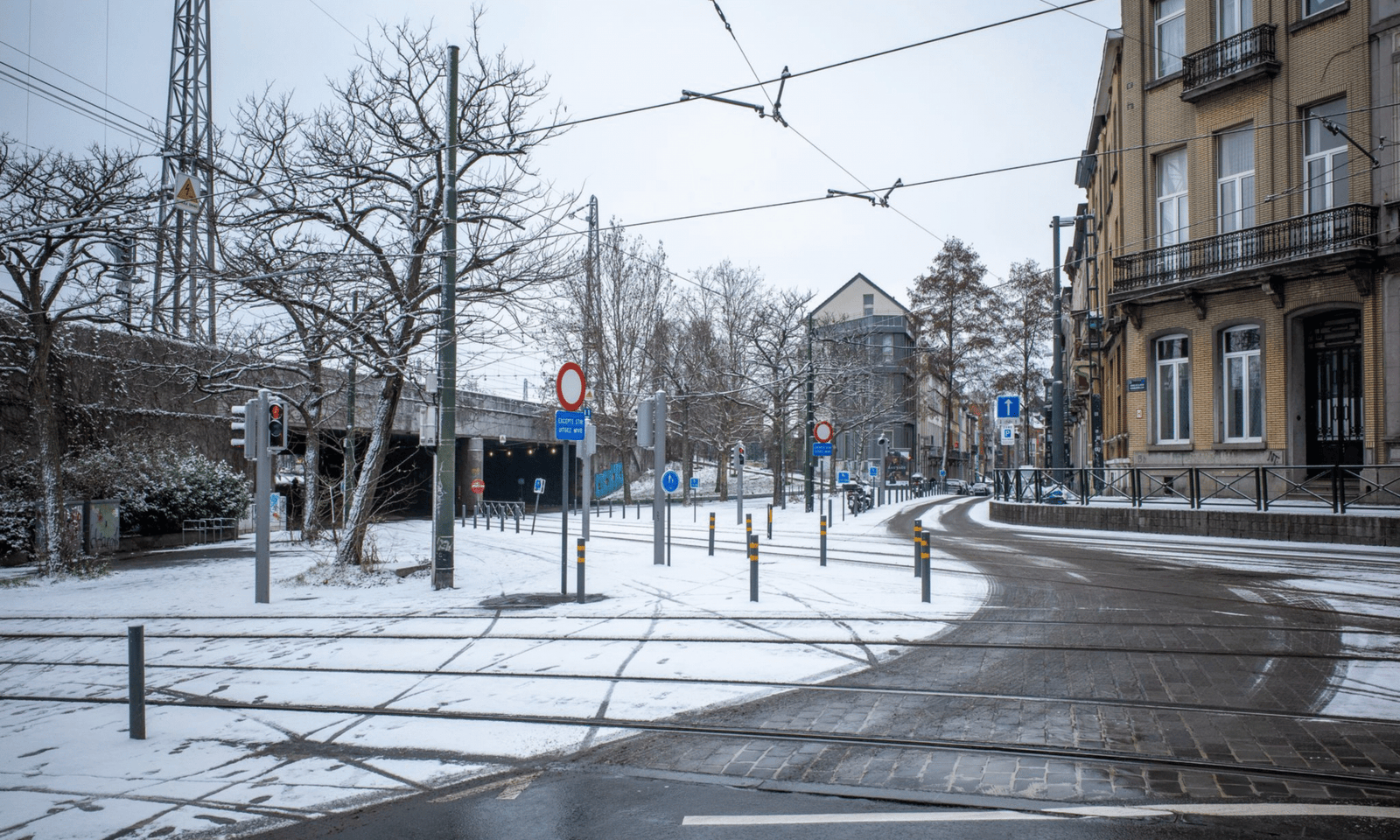 Snowy street with tram tracks